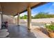 Covered patio with string lights overlooking the pool at 10468 W Palm Ln, Avondale, AZ 85392