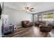 Gathering room with hardwood floors and comfy leather furniture at 10468 W Palm Ln, Avondale, AZ 85392