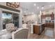 Open kitchen with an island and breakfast nook, overlooking the living room at 41619 N River Bend Rd, Anthem, AZ 85086