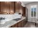 Well-equipped kitchen with gas cooktop and custom cabinetry at 41619 N River Bend Rd, Anthem, AZ 85086