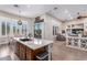 Spacious kitchen with granite countertops, stainless steel appliances, and an island at 41619 N River Bend Rd, Anthem, AZ 85086