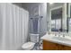 Clean bathroom with a shower/tub combo and wood vanity at 41619 N River Bend Rd, Anthem, AZ 85086