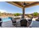 Inviting backyard oasis with a sparkling pool and patio furniture at 41619 N River Bend Rd, Anthem, AZ 85086