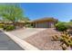 Two-car garage and desert landscaping enhance curb appeal at 41619 N River Bend Rd, Anthem, AZ 85086