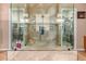 Large walk-in shower with glass enclosure and marble tile at 41619 N River Bend Rd, Anthem, AZ 85086