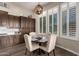 Charming kitchen nook with a rustic wooden table and chairs at 41619 N River Bend Rd, Anthem, AZ 85086