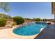 Expansive swimming pool with a stone waterfall feature at 41619 N River Bend Rd, Anthem, AZ 85086