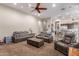Relaxing living room with comfortable seating and views into the kitchen at 41619 N River Bend Rd, Anthem, AZ 85086