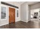 Spacious entryway with wood flooring and view to bedroom at 41619 N River Bend Rd, Anthem, AZ 85086