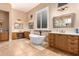 Luxurious bathroom with a freestanding tub and double vanities at 41619 N River Bend Rd, Anthem, AZ 85086