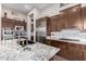 Eat-in kitchen with granite countertops and ample cabinetry at 41619 N River Bend Rd, Anthem, AZ 85086