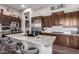 Modern kitchen featuring granite countertops and stainless steel appliances at 41619 N River Bend Rd, Anthem, AZ 85086