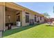 Artificial turf backyard with a patio and outdoor heater at 41619 N River Bend Rd, Anthem, AZ 85086