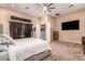 Main bedroom with sliding doors leading to a private patio at 41619 N River Bend Rd, Anthem, AZ 85086