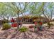 Landscaped backyard with a covered patio and outdoor kitchen at 41619 N River Bend Rd, Anthem, AZ 85086