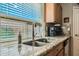 Kitchen sink and countertop with granite and stainless steel finishes at 28829 N Broken Shale Dr, San Tan Valley, AZ 85143