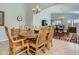 Formal dining room with wooden table and chairs, and access to backyard at 28829 N Broken Shale Dr, San Tan Valley, AZ 85143