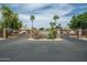 Gated community entrance with signage and landscaping at 10056 E Capri Ave, Mesa, AZ 85208