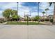 Basketball court with surrounding landscaping and homes in background at 10056 E Capri Ave, Mesa, AZ 85208