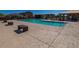 Community pool with surrounding seating at 18208 W Daley Ln, Surprise, AZ 85387