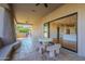 Outdoor patio with seating area, built-in grill, and access to kitchen at 24005 N 45Th Dr, Glendale, AZ 85310