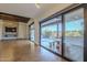 Living area with sliding glass doors opening to a pool and patio at 24005 N 45Th Dr, Glendale, AZ 85310
