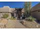 This home features a charming entryway with a custom wood door at 24005 N 45Th Dr, Glendale, AZ 85310