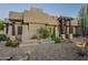 Front view of a single-story home with stucco walls and a desert landscape at 24005 N 45Th Dr, Glendale, AZ 85310