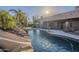 Luxury pool with a waterfall and adjacent patio at 24005 N 45Th Dr, Glendale, AZ 85310