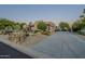 Xeriscaped front yard with stucco home and driveway at 24005 N 45Th Dr, Glendale, AZ 85310