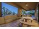 Covered patio with seating area, built-in grill, and fireplace at 24005 N 45Th Dr, Glendale, AZ 85310