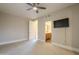 Spacious bedroom with ensuite bathroom and large TV at 24005 N 45Th Dr, Glendale, AZ 85310