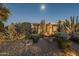 Xeriscaped front yard with mature desert plants and rock accents at 24005 N 45Th Dr, Glendale, AZ 85310