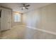 Bright bedroom with neutral walls, ceiling fan, and window shutters at 24005 N 45Th Dr, Glendale, AZ 85310