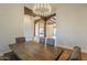 Open dining room with wood floors and view into Gathering room at 24005 N 45Th Dr, Glendale, AZ 85310