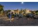 Attractive desert landscaping highlights the home's exterior at 24005 N 45Th Dr, Glendale, AZ 85310