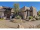 Elegant entryway with a custom wood door and stone accents at 24005 N 45Th Dr, Glendale, AZ 85310