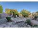 Landscaped backyard with fire pit and desert landscaping at 24005 N 45Th Dr, Glendale, AZ 85310