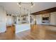 Modern kitchen with white cabinets, island, and stainless steel appliances at 24005 N 45Th Dr, Glendale, AZ 85310