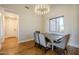 Light and airy dining room with wood floors and a large window at 24005 N 45Th Dr, Glendale, AZ 85310