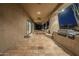 Long covered patio with tiled floor, seating, and outdoor kitchen at 24005 N 45Th Dr, Glendale, AZ 85310