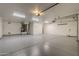 Spacious garage with overhead storage and epoxy flooring at 24005 N 45Th Dr, Glendale, AZ 85310