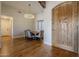 Bright dining room with hardwood floors and a rustic chandelier at 24005 N 45Th Dr, Glendale, AZ 85310