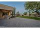 Large backyard with grassy area, covered patio and brick pavers at 24005 N 45Th Dr, Glendale, AZ 85310