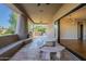Outdoor patio with seating area, built-in grill, and access to kitchen at 24005 N 45Th Dr, Glendale, AZ 85310