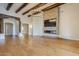 Living room features hardwood floors, fireplace, and large TV at 24005 N 45Th Dr, Glendale, AZ 85310