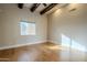 Spacious bedroom with wood floors, ceiling fan and large window at 24005 N 45Th Dr, Glendale, AZ 85310
