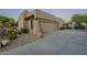 Stucco home with double garage doors and landscaping at 24005 N 45Th Dr, Glendale, AZ 85310