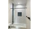 Clean bathroom with a herringbone tiled bathtub surround, and modern fixtures at 58Xx N Nigal Rd, Casa Grande, AZ 85194