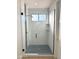 Spa-like shower with herringbone tile, frameless glass enclosure and modern fixtures at 58Xx N Nigal Rd, Casa Grande, AZ 85194